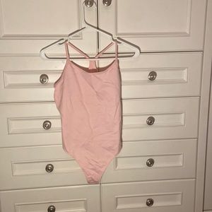 TNA Bodysuit. NEVER WORN. TAG ON.